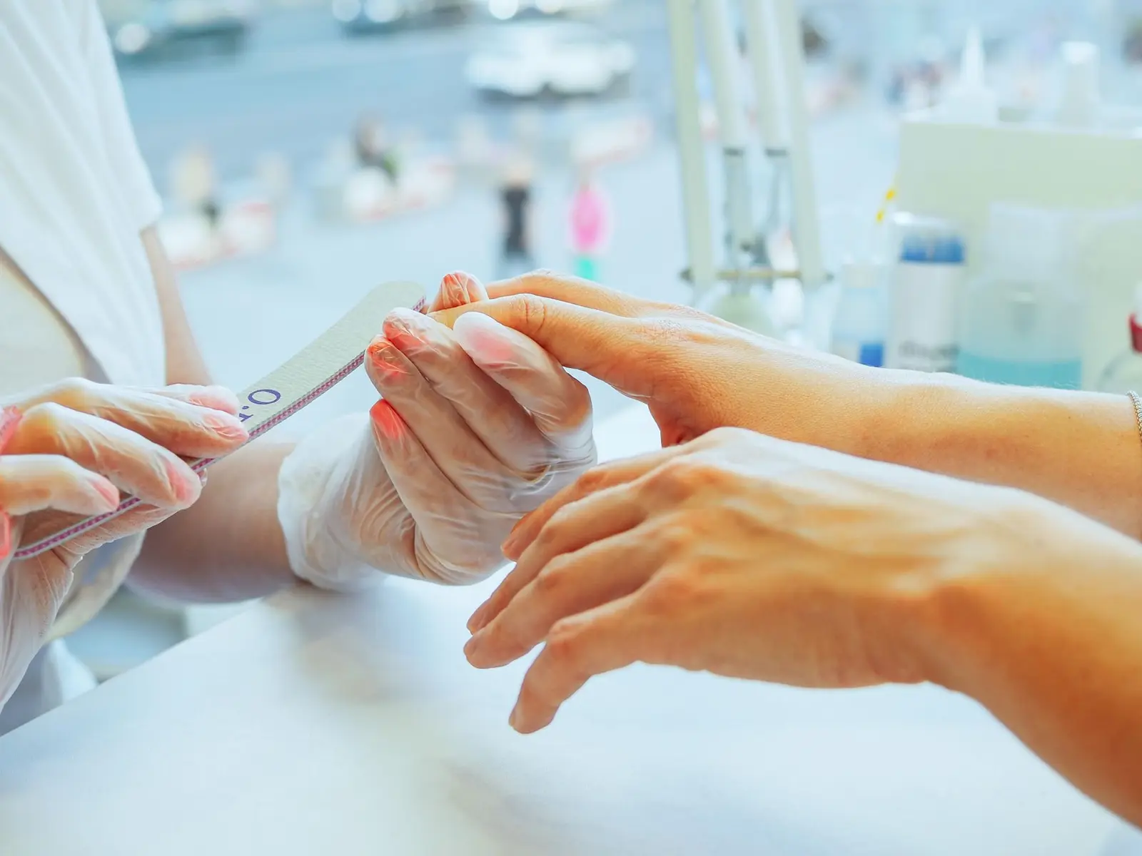 Beautician giving a manicure treatment — a West Midlands trades business we support