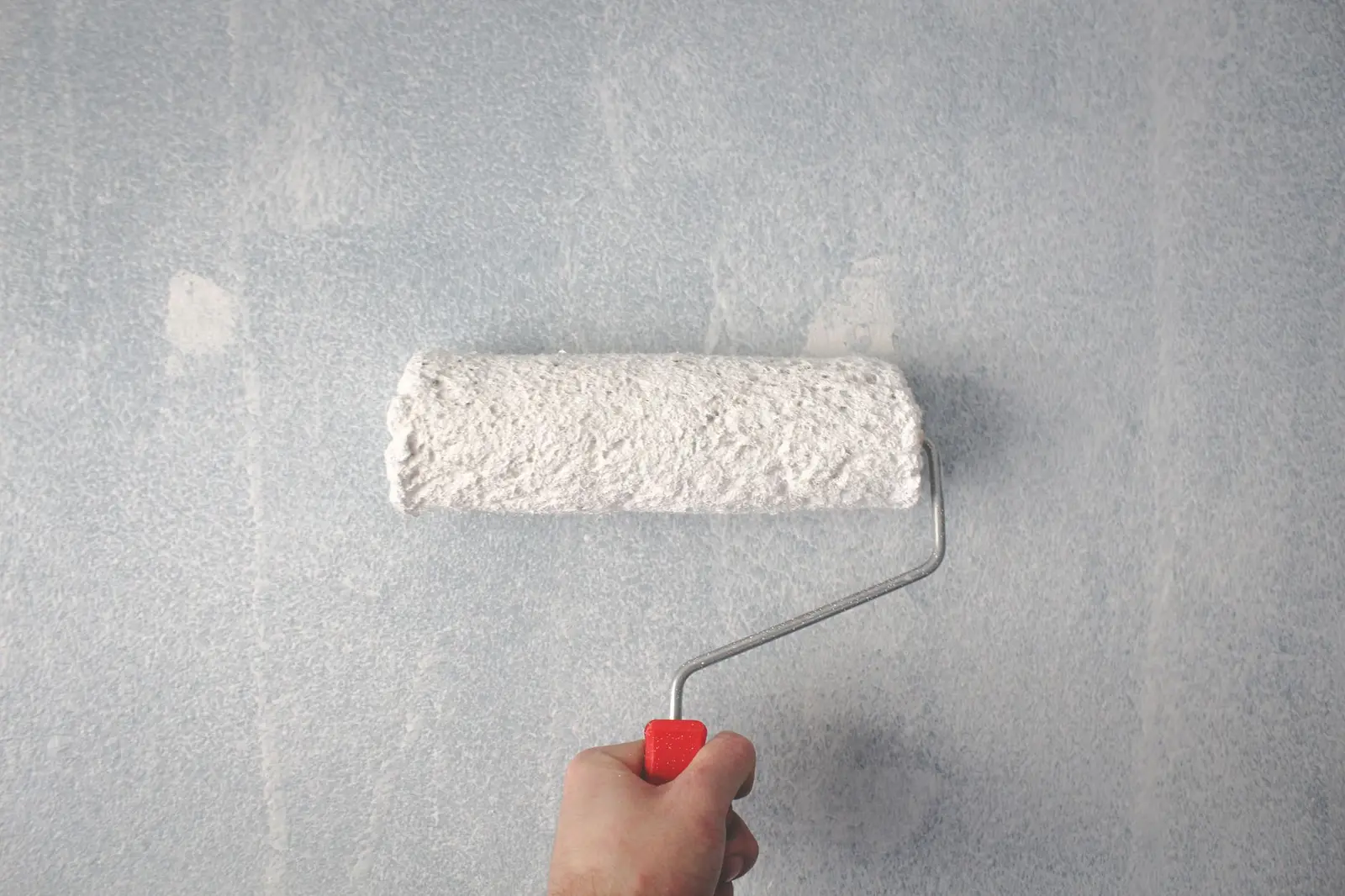 Painter and decorator at work — a West Midlands trades business we support