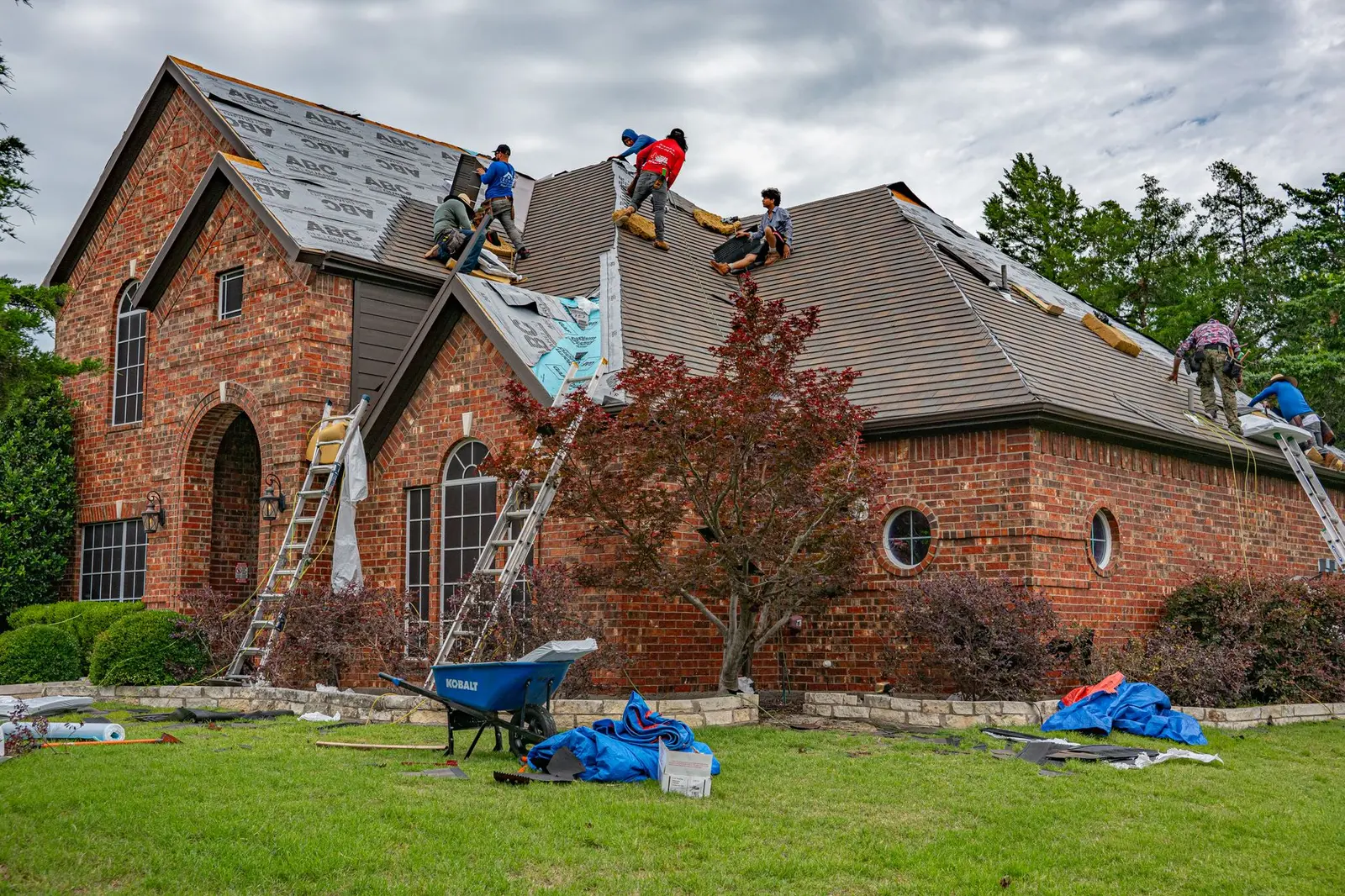 Roofers renovating a roof — a West Midlands trades business we support